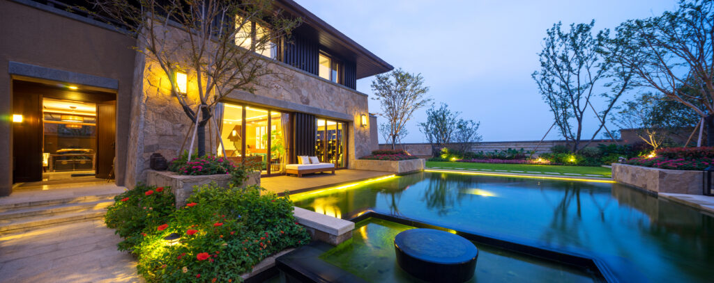 Luxury Landscape Lighting for a pool in the evening.