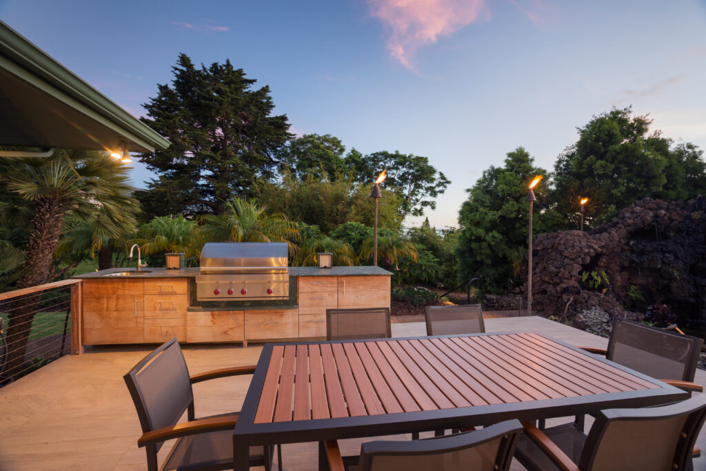 A spacious outdoor kitchen at sunset.