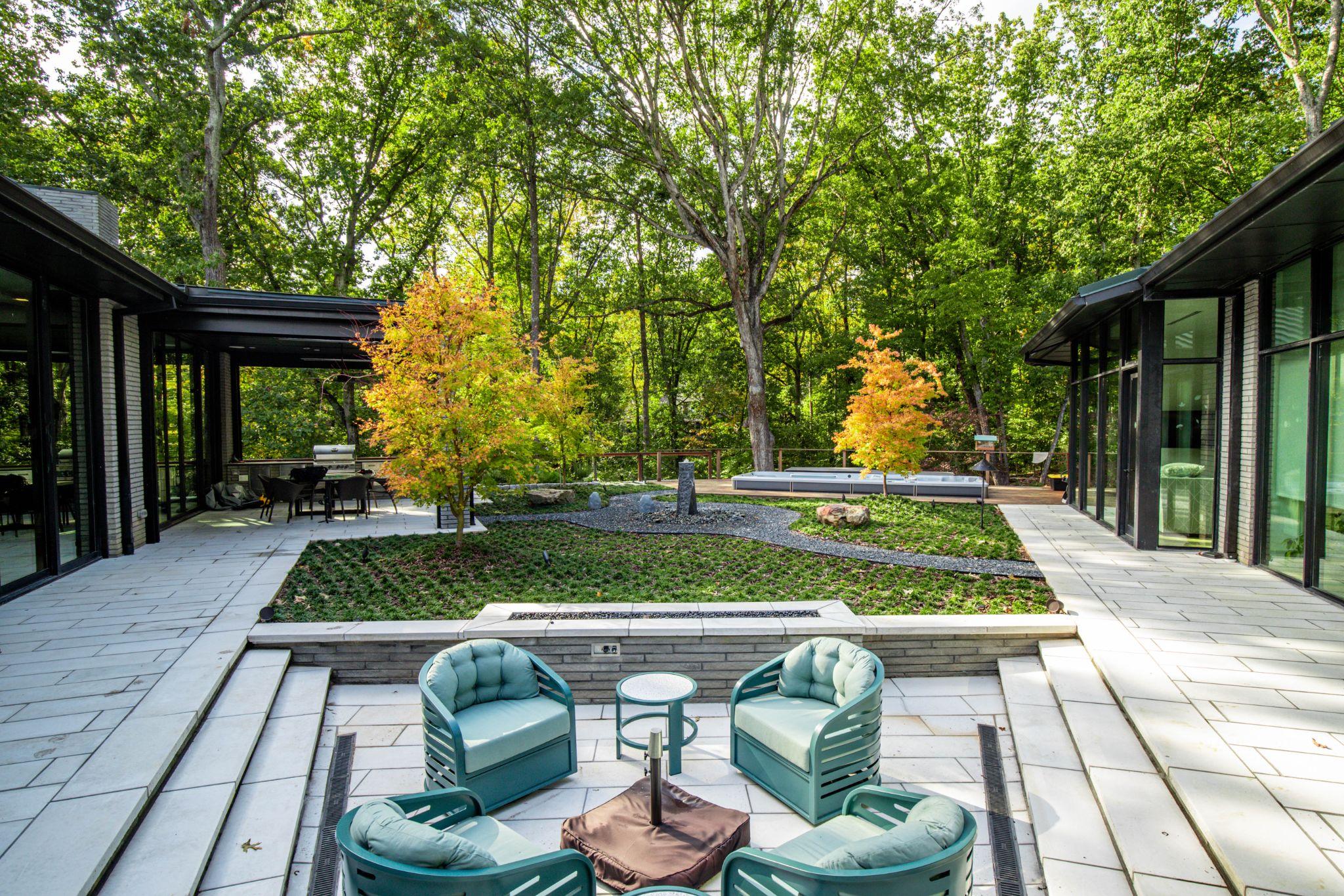 Modern courtyard patio with built-in seating and minimalist landscape design